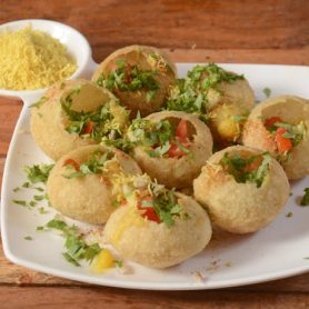 istockphoto-1292640617-612x612 Sev puri is a famous midday snack in india, served over a rustic wooden background, selective focus